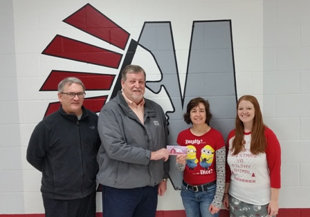 Peoples Bank & Trust presents a $5000 donation to the Morrisonville Community School District.