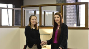 Peoples Bank & Trust Employees shaking hands