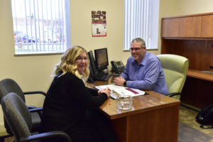 Peoples Bank & Trust Employee meeting with customer