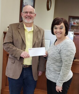 Peoples Bank & Trust presents Taylorville School District with donation to purchase a new plasma cutter for the vocational education program.